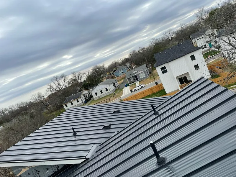 Standing seam metal roof panels with vents for Skylight Repair in Medford